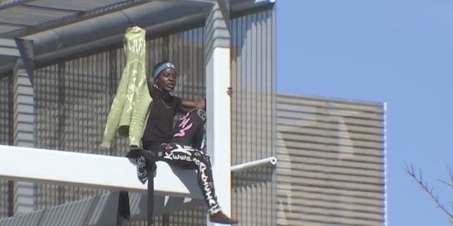 Therese Patricia Okoumou spent nearly 8 hours on the Southwest Key building in East Austin.