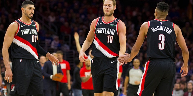 Enes Kanter #00, Jake Layman #10, and CJ McCollum #3 of the Portland Trail Blazers react against the Philadelphia 76ers in the fourth quarter at the Wells Fargo Center on February 23, 2019, in Philadelphia, Pennsylvania. The Trail Blazers defeated the 76ers 130-115. (Photo by Mitchell Leff/Getty Images)