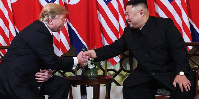 US President Donald Trump (L) shakes hands with North Korea's leader Kim Jong Un following a meeting at the Sofitel Legend Metropole hotel in Hanoi on February 27, 2019. (SAUL LOEB/AFP/Getty Images)