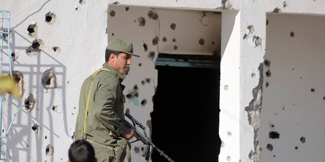 A member of the Tunisian special forces stands outside a bullet-riddled house in the southern town of Ben Guerdane, near the Libyan border, during clashes with jihadists in 2016.