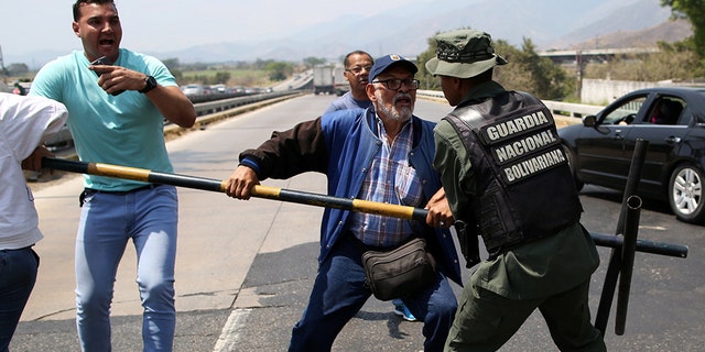 The clash came as Maduro announced Thursday plans to close the vast, jungle border with Brazil a day after he blocked air and sea travel between Venezuela and the nearby Dutch Caribbean island of Curacao, where the first cargo of relief supplies arrived earlier that day.