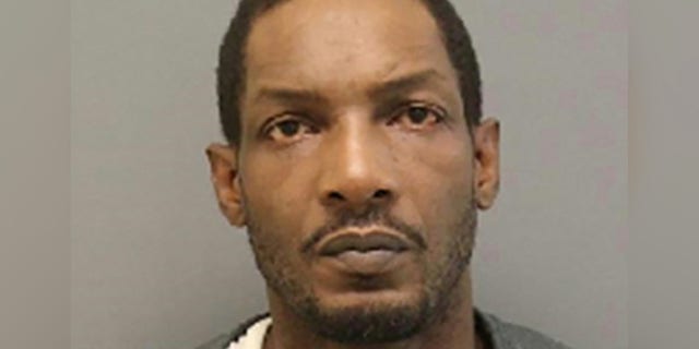 Antonio Smallwood was allegedly projecting pornographic material on his garage door when police arrived.