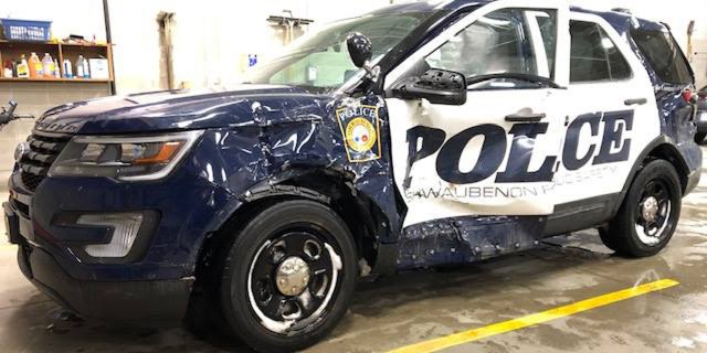 The aftermath of a semi-truck striking a police vehicle in Wisconsin on Monday.