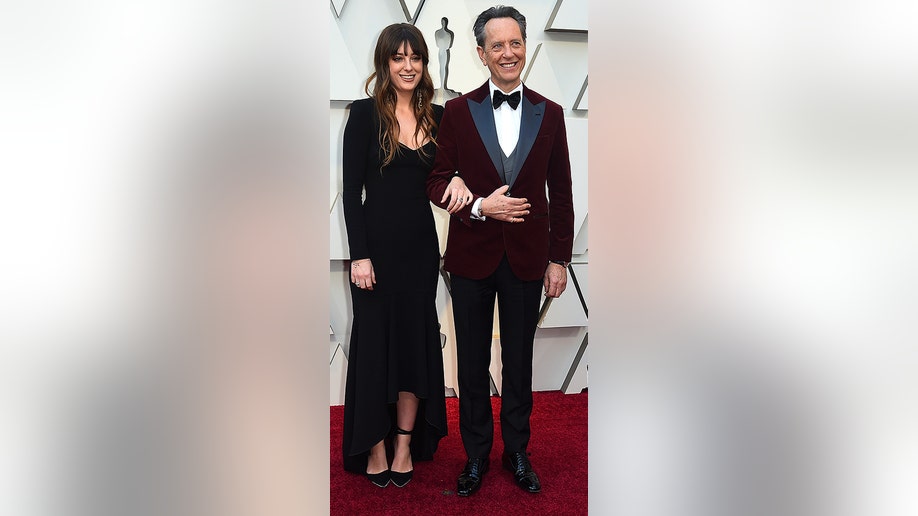 Olivia Grant, left, and Richard E. Grant arrive at the Oscars on Sunday, Feb. 24, 2019, at the Dolby Theatre in Los Angeles. (Photo by Jordan Strauss/Invision/AP)