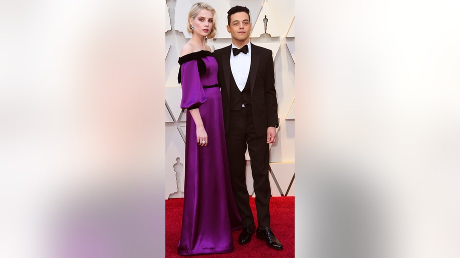 Lucy Boynton, left, and Rami Malek arrive at the Oscars on Sunday, Feb. 24, 2019, at the Dolby Theatre in Los Angeles. (Photo by Richard Shotwell/Invision/AP)