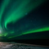 The aurora borealis or northern lights are visible in the sky above a lighthouse in the village of Grundarfjorour, Iceland, Feb. 4, 2019. 