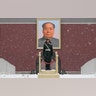 Chinese paramilitary policemen stand guard under the portrait of former leader Mao Zedong outside the Tiananmen Gate in Beijing, Feb. 12, 2019. 