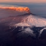 Smoke billows from Mount Etna volcano, the largest of Italy's three active volcanoes, near the Sicilian town of Catania, southern Italy, Feb. 20, 2019.