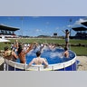 England cricket fans watch day one of the second test cricket matches against West Indies, from a pool at the Sir Vivian Richards Stadium in North Sound, Antigua, and Barbuda, January 31, 2019. 