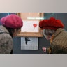 People look at the shredded Banksy painting "Love is in the Bin" at the Museum Frieder Burda in Baden-Baden, Germany, Feb. 5, 2019, 