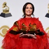 Kacey Musgraves, winner of the awards for best country album for "Golden Hour", best country song for "Space Cowboy," best country solo performance for "Butterflies" and album of the year for "Golden Hour" holds her trophies at the 61st annual Grammy Awards in Los Angeles, Feb. 10, 2019. 