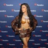 Cardi B ditches her shirt for the Fanatics Super Bowl Party at College Football Hall of Fame on February 2, 2019 in Atlanta, Georgia.
