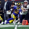 New England Patriots' Rob Gronkowski catches a pass in front of Los Angeles Rams' Marcus Peters and Cory Littleton during the fourth quarter of Super Bowl LIII in Atlanta, Feb. 3, 2019.