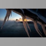 The sun rises behind icicles formed on the harbor in Port Washington, Wisconsin, January 30, 2019.