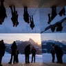 People visit the installation called 'Mirage Gstaad' by American artist Doug Aitken, in Gstaad, Switzerland, Feb. 20, 2019.