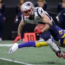 New England Patriots Julian Edelman breaks away from Los Angeles Rams' Troy Hill during the Super Bowl in Atlanta, February 3. 2019