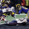 New England Patriots Sony Michel dives over the goal line for a touchdown in front of Los Angeles Rams' Cory Littleton during the second half of the Super Bowl in Atlanta, February 3. 2019.