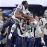 New England Patriots Dont'a Hightower gives a lift to a teammate as they celebrate winning the Super Bowl over the Los Angeles Rams, in Atlanta, February 3. 2019.
