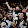 New England Patriots fans cheer while watching the Super Bowl in a bar in Boston, February 3, 2019.