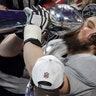 New England Patriots David Andrews kisses the Vince Lombardi Trophy after winning the Super Bowl against the Los Angeles Rams in Atlanta, February 3. 2019.
