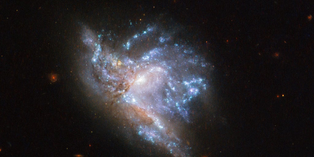 Galaxy Collision Creates “Space Triangle” in New Hubble Image 