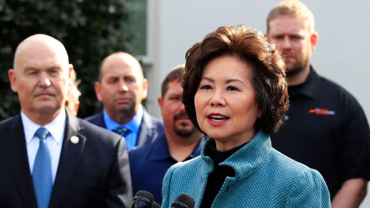 Transportation Secretary Elaine Chao, right, with U.S. Maritime Administration Administrator Mark Buzby, speaks to reporters outside the West Wing of the White House. (Associated Press)