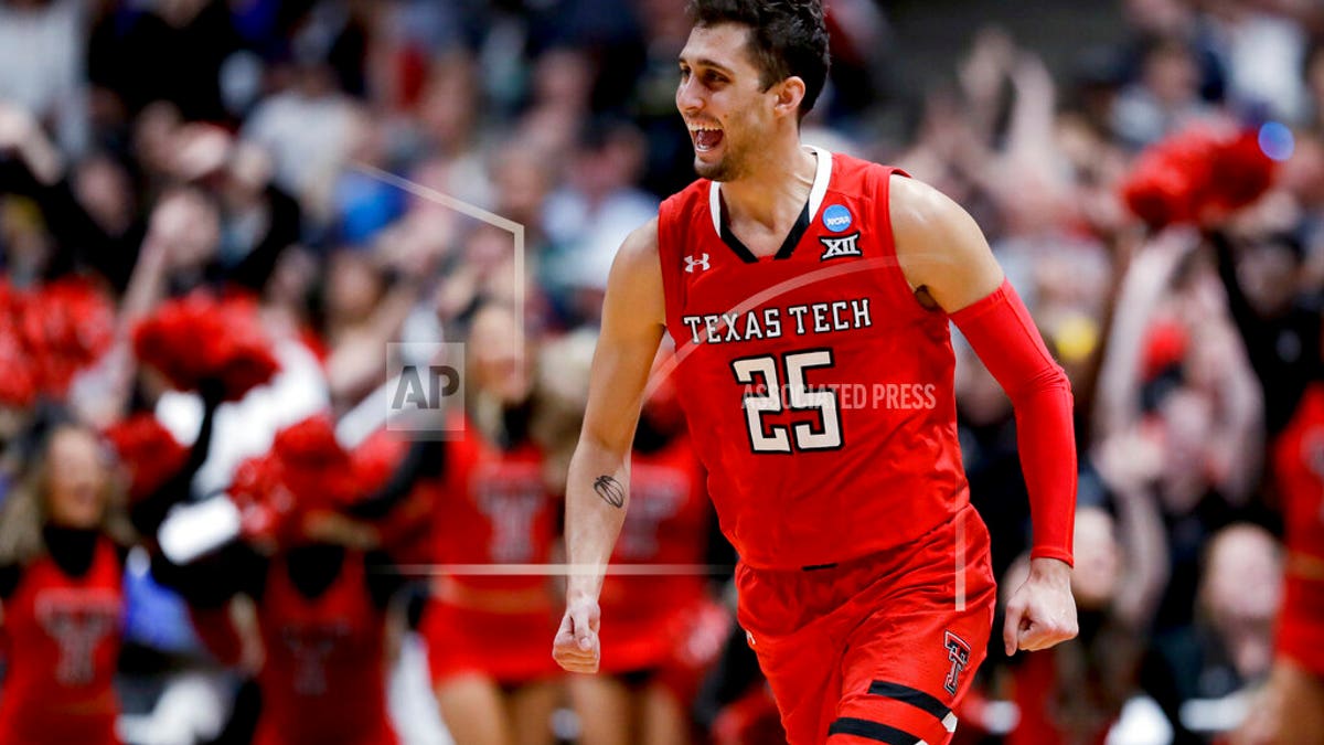 Texas Tech guard Davide Moretti celebrates after scoring against Gonzaga during the second half of the West Regional final in the NCAA men's college basketball tournament Saturday, March 30, 2019, in Anaheim, Calif. (AP Photo/Marcio Jose Sanchez)