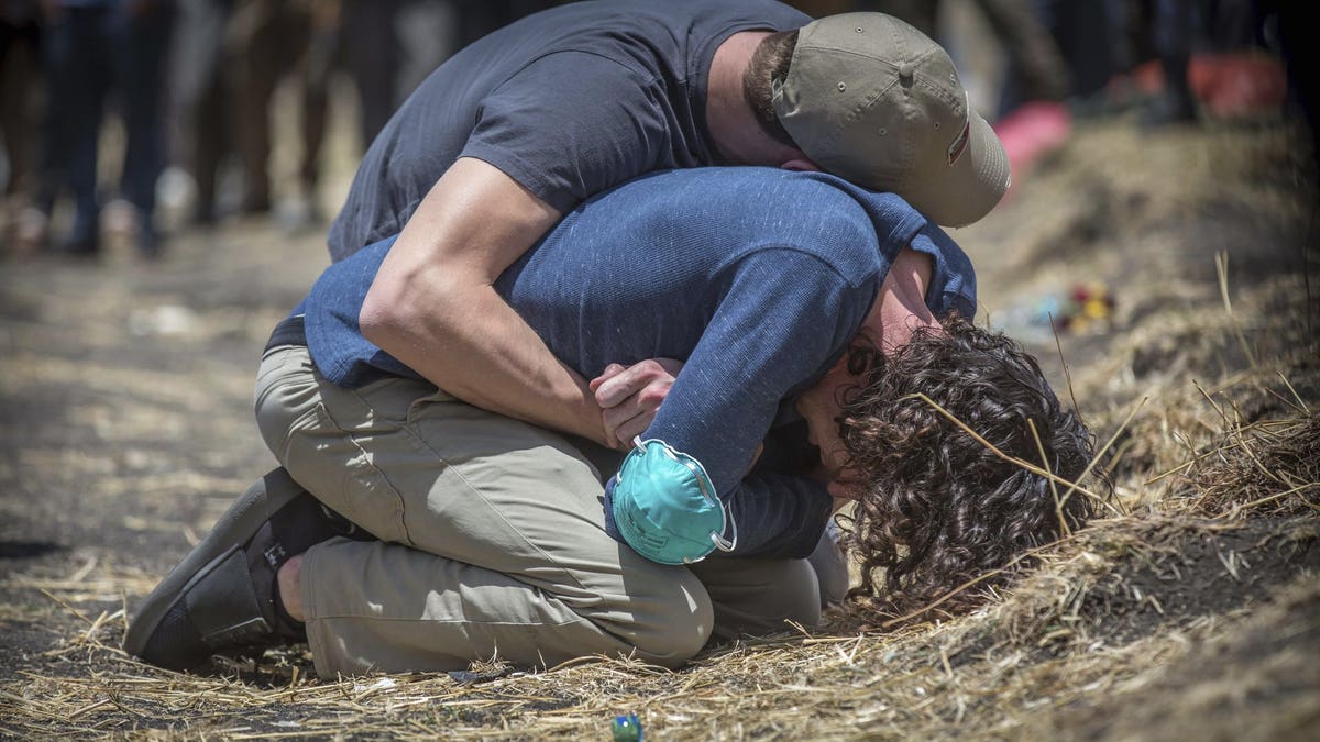 Relatives react at the scene where the Ethiopian Airlines Boeing 737 Max 8 crashed shortly after takeoff. The black box from the Boeing jet that crashed will be sent overseas.