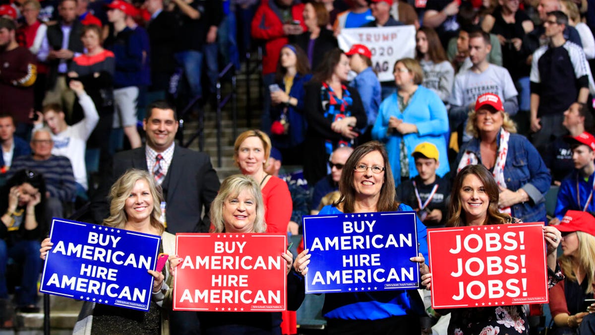 People waiting for President Donald Trump to speak at the rally in Grand Rapids, Mich., on Thursday. (AP Photo/Manuel Balce Ceneta)
