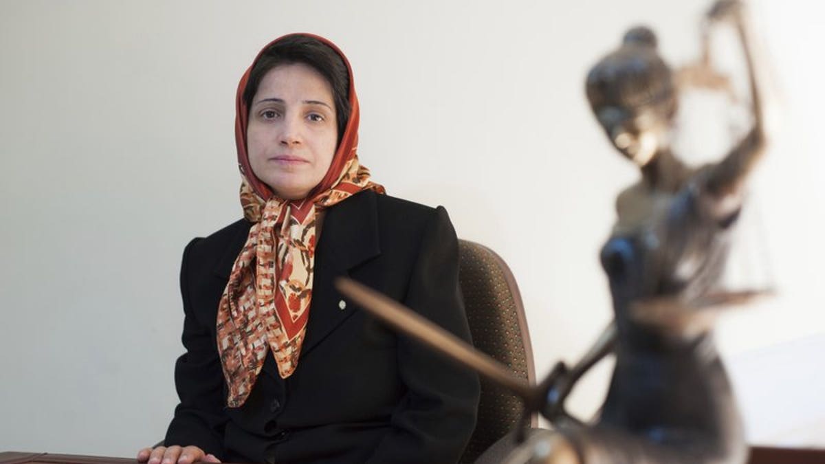 In this Nov. 1, 2008 photo, Iranian human rights lawyer Nasrin Sotoudeh, poses for a photograph in her office in Tehran, Iran. On Wednesday, March 6, 2019, the New York-based Center for Human Rights in Iran, said Sotoudeh, a prominent human rights lawyer in Iran who defended women protesting against the Islamic Republic's mandatory headscarf, has been convicted and faces years in prison.