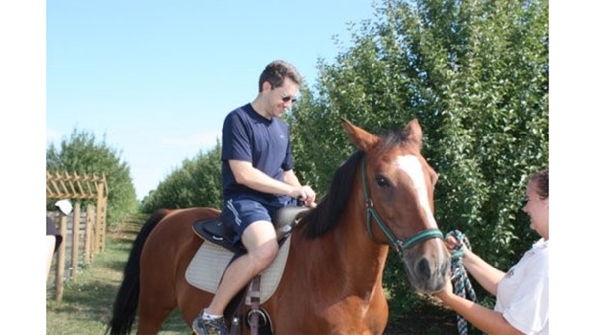 Dan Markel riding a horse