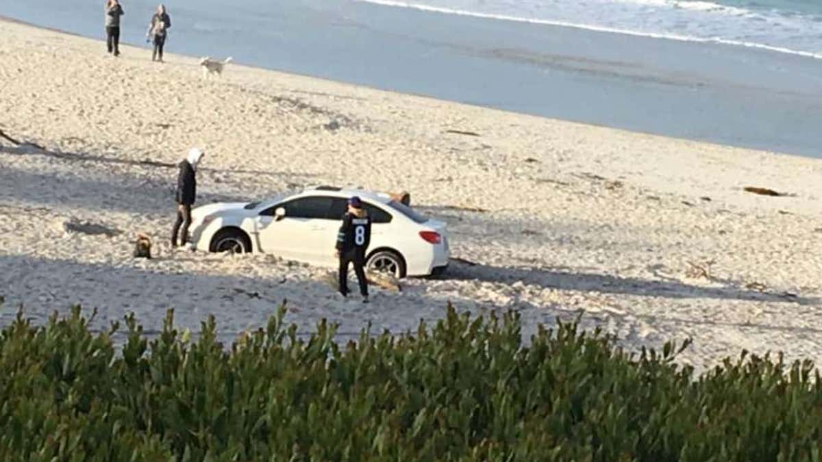 "What not to do: Drive car on beach to impress girlfriend."