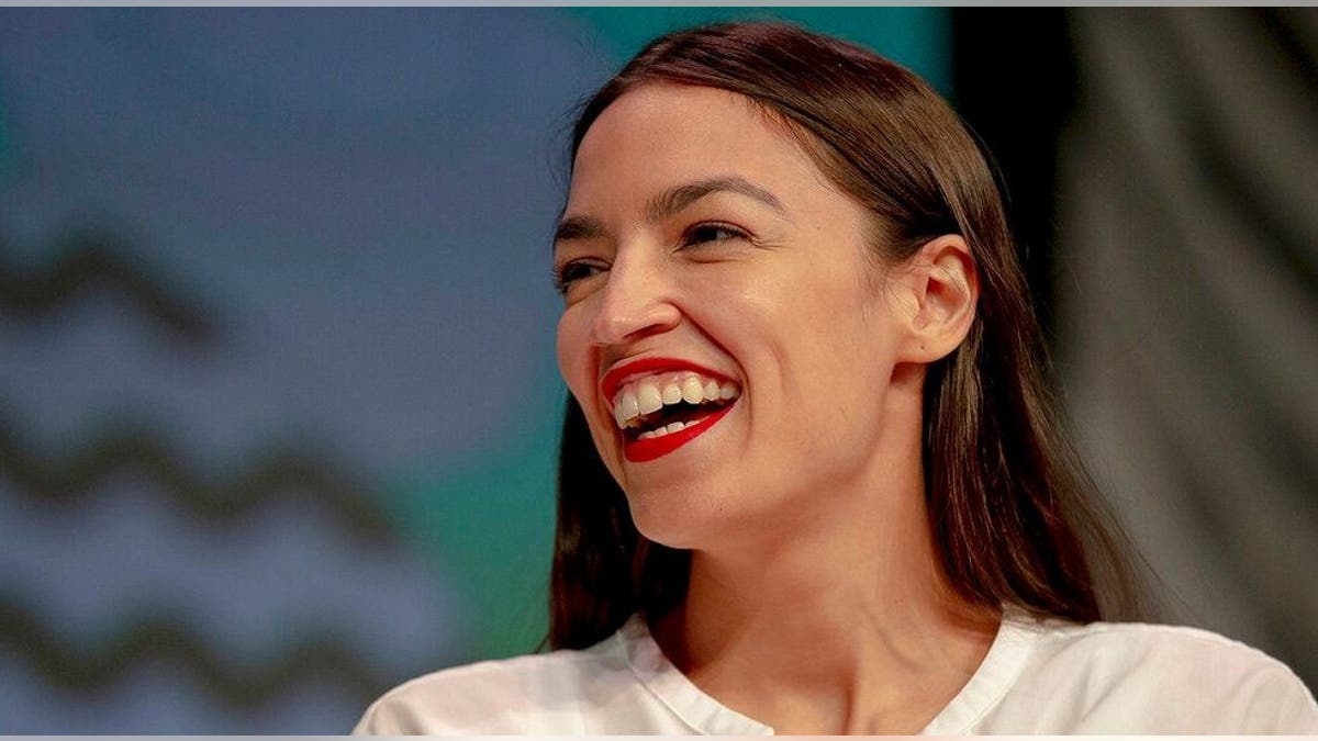Rep. Alexandria Ocasio-Cortez, D-New York, laughs during South by Southwest on Saturday, March 9, 2019, in Austin, Texas. The festival has grown from obscure roots into a weeklong juggernaut of tech, politics and entertainment. (Nick Wagner/Austin American-Statesman via AP)