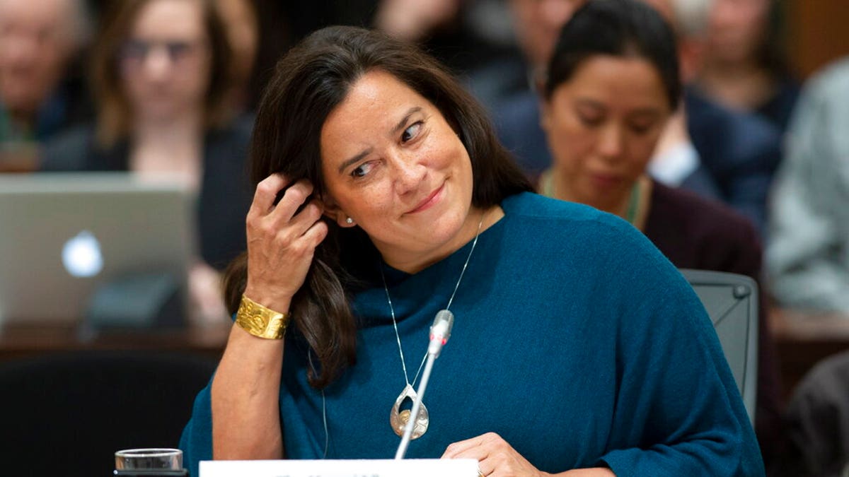 Jody Wilson Raybould adjusts her earpiece as she waits to appear in front of the Justice committee in Ottawa, Wednesday February 27, 2019. 7, 2019.