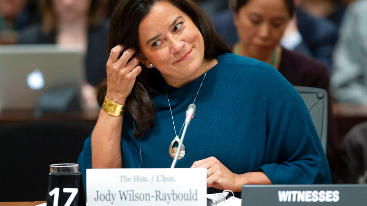 Jody Wilson Raybould adjusts her earpiece as she waits to appear in front of the Justice committee in Ottawa, Wednesday February 27, 2019. 7, 2019.