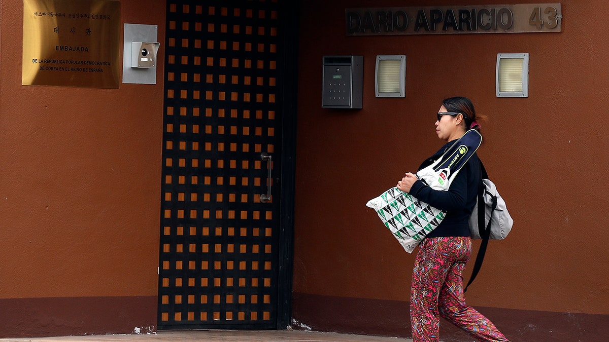 A woman walks past North Korea's embassy in Madrid, Spain, Thursday, Feb. 28, 2019.