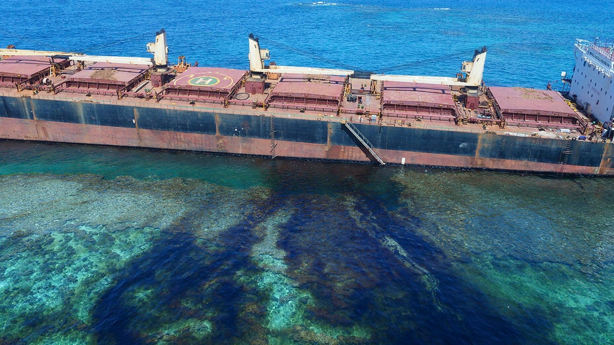 In this Feb. 26, 2019, photo taken by the Australian Maritime Safety Authority near Rennell Island in the Solomon Islands shows the “MV Solomon Trader” ship which ran aground Feb. 5.