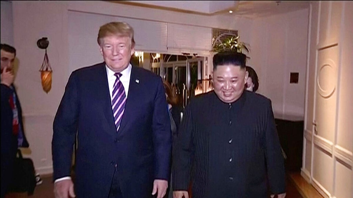 In this image made from video released on Wednesday, March 6, 2019, by North Korean broadcaster KRT, North Korean leader Kim Jong Un, right, smiles while walking with U.S. President Donald Trump for a meeting in Hanoi, Vietnam.