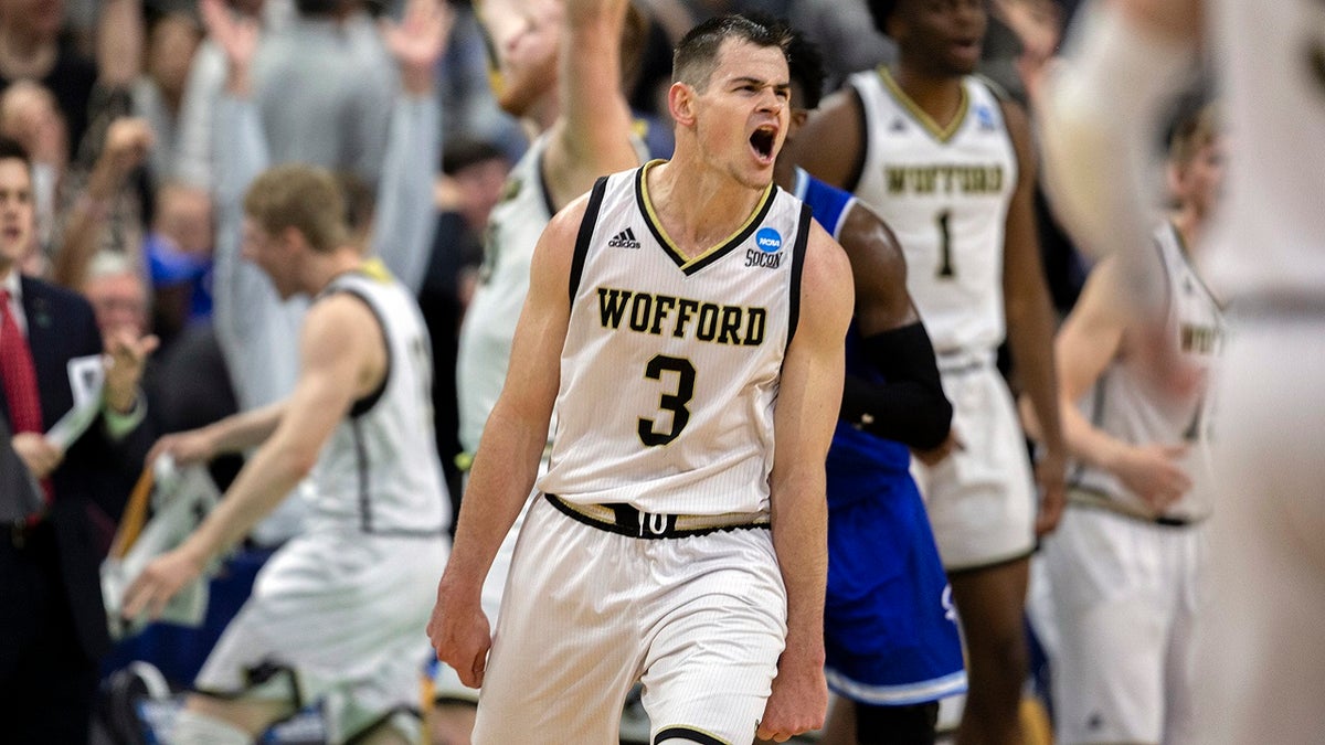 Wofford guard Fletcher Magee (3) celebrates with teammates after hitting a 3-point basket during the final moments of the second half against Seton Hall in a first-round game in the NCAA men’s college basketball tournament in Jacksonville, Fla. Thursday, March 21, 2019.