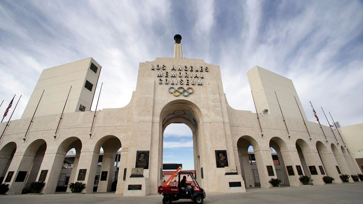 The University of Southern California's sale of naming rights for Los Angeles Memorial Coliseum is being criticized as dishonoring the historic stadium's dedication as a memorial to soldiers who fought and died in World War I. (Associated Press)