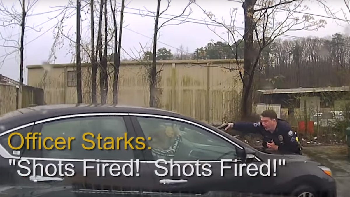 Officer Charles Starks can be seen reporting shots fired while on the car's hood during the Feb. 22 incident.