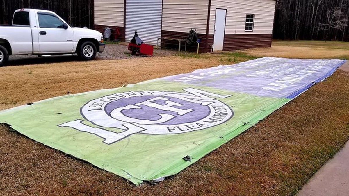 The Lee County Flea Market sign ended up in a yard in Hamilton, Georgia, located 20 miles away from the billboard it was located on.