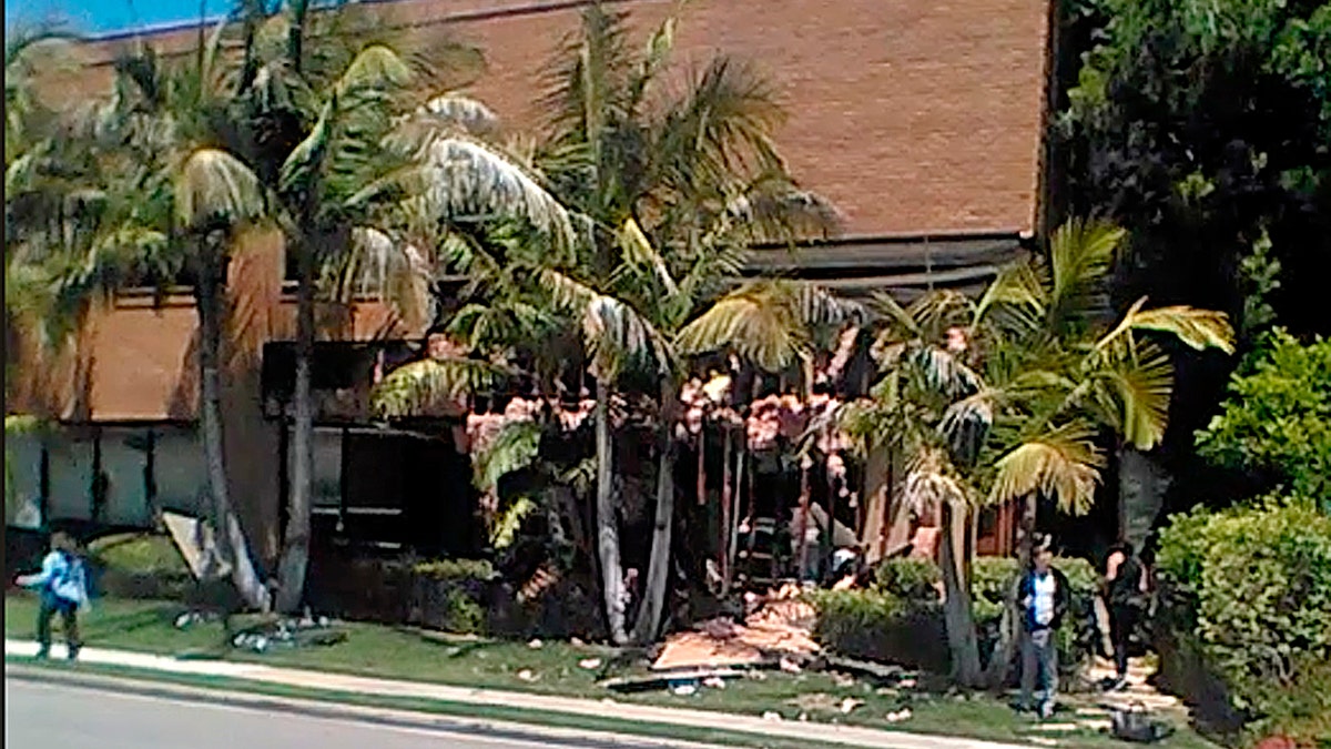 FILE - This May 15, 2018, file image taken from cellphone video shows a building after a fatal explosion in Aliso Viejo, Calif.