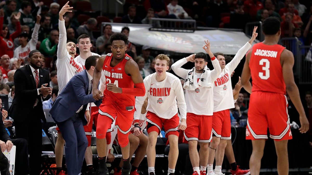 Ohio State bench celebrate after Andre Wesson (24) scores a 3-point shot during the second half of an NCAA college basketball game against Michigan State in the quarterfinals of the Big Ten Conference tournament, Friday, March 15, 2019, in Chicago. (AP Photo/Nam Y. Huh)