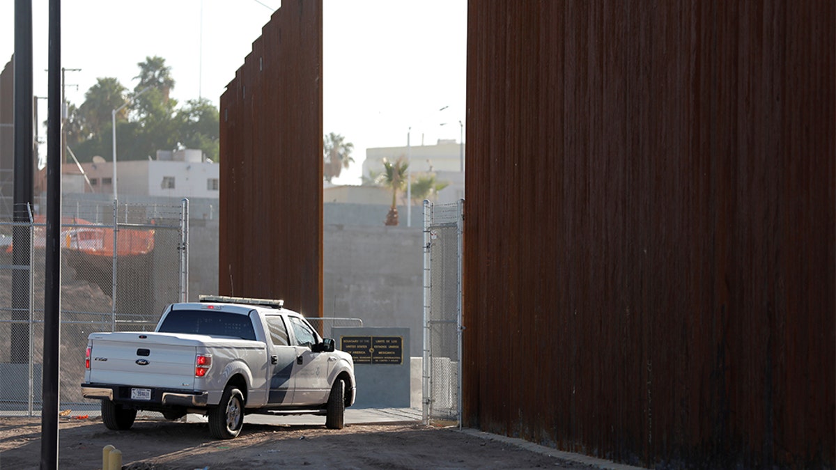 FILE - A Border Patrol vehicle guards the wall at the border prior to U.S. Department of Homeland Security Secretary Kirstjen Nielsen visit to U.S. President Trump's border wall in the El Centro Sector in Calexico, Calif.,  last year. REUTERS