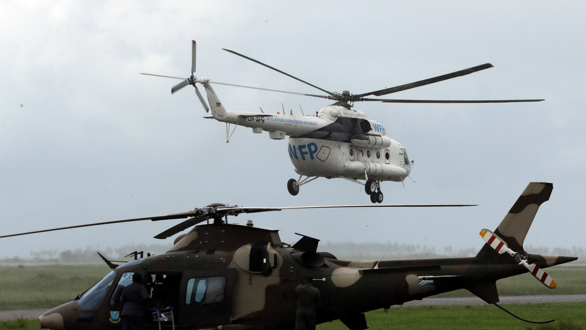 A World Food Program helicopter takes off, in Beira, Mozambique, March 22, 2020. (AP Photo/Themba Hadebe)