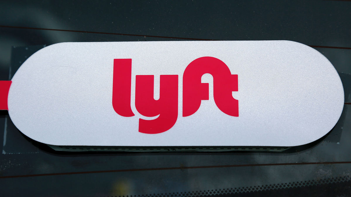 A Lyft logo in the window of a vehicle