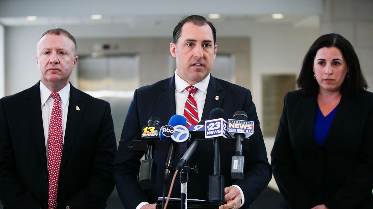 John R. Lausch Jr., U.S. Attorney for the Northern District of Illinois, center, briefs reporters on the trial of Floyd Brown in the killing of Special Deputy United States Marshal Jacob Keltner on Wednesday, March 20, 2019, U.S. District Courthouse in Rockford. Brown pleaded not guilty Wednesday to federal charges accusing him of fatally shooting Keltner, who was trying to serve an arrest warrant at a hotel. (Scott P. Yates/Rockford Register Star via AP)