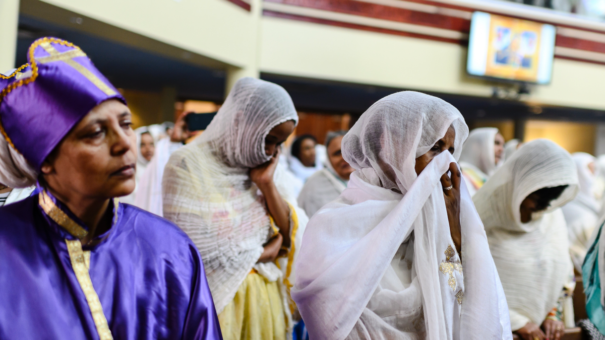Members of the Ethiopian community taking part in a special prayer for the victims of the Ethiopian Airlines flight ET302 crash, at the Ethiopian Orthodox Tewahedo Church of Canada Saint Mary Cathedral in Toronto, on Sunday. (Christopher Katsarov/The Canadian Press via AP)
