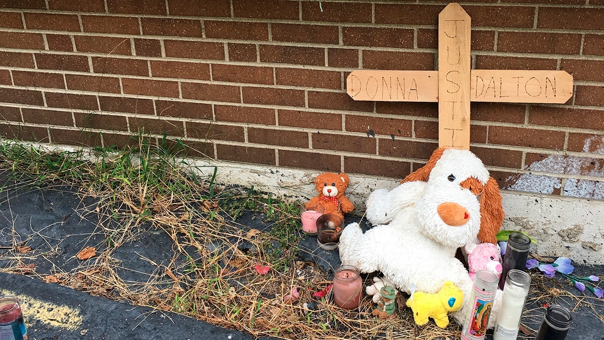 Photo shows what is left of a make-shift memorial to Donna Castleberry near the scene of her August shooting death in Columbus, Ohio. (AP Photo/Andrew Welsh-Huggins)